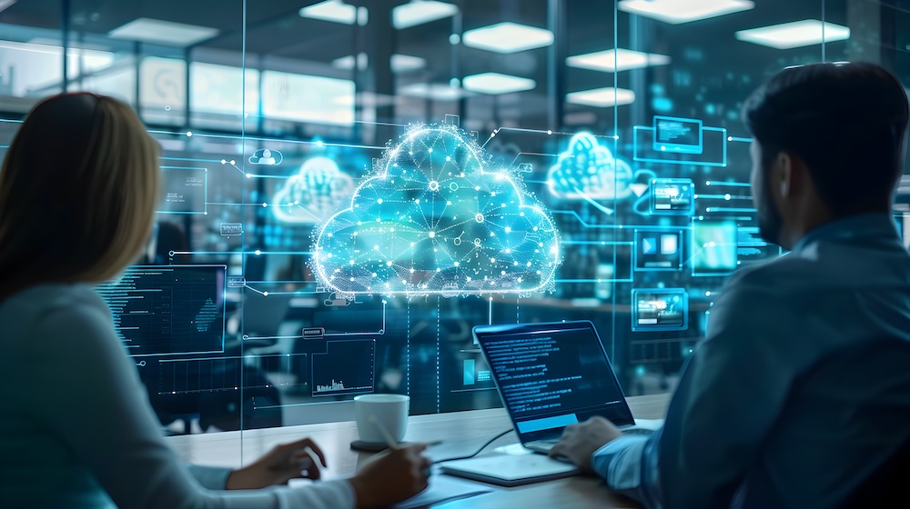 A high-tech office setting with a team of professionals discussing cloud computing strategies and digital communication solutions on interactive digital whiteboards